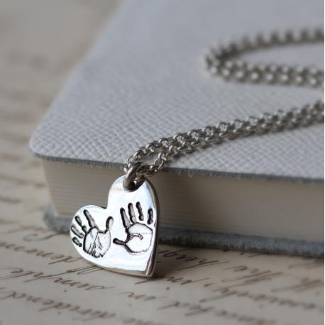 Small charm on Hand & Footprint Heart Necklace