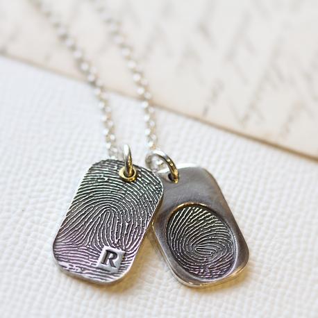 One fingerprint covering all of dog tag and oval shaped fingerprint dog tag